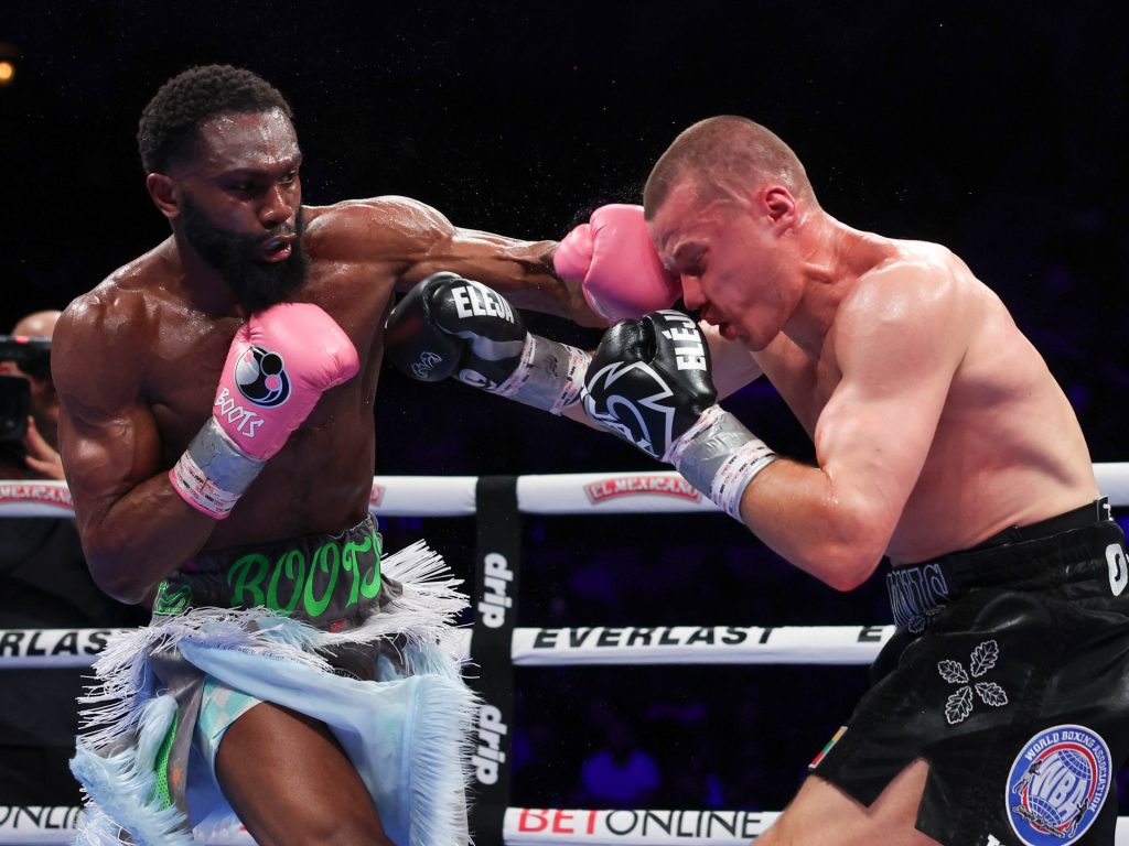 Ennis downs stanionis per unificare le cinture welter welter della boxe di boxe